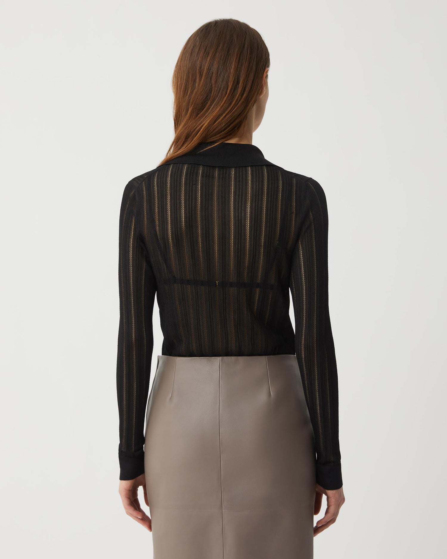 Black Lydia Silk Crepe Polo from SALE, showcasing a stylish knitwear top with a smooth, elegant fabric and classic fit.