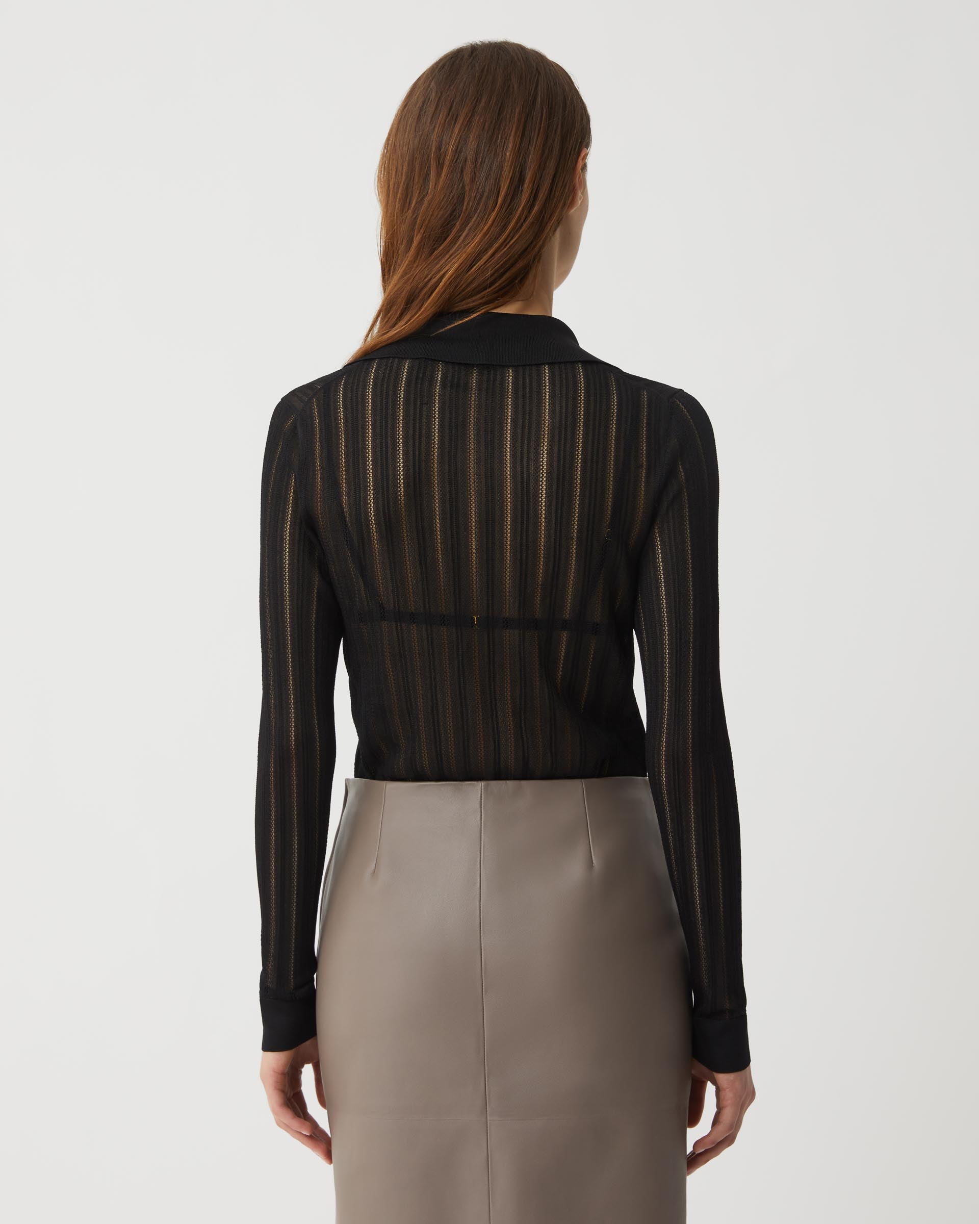 Black Lydia Silk Crepe Polo from SALE, showcasing a stylish knitwear top with a smooth, elegant fabric and classic fit.