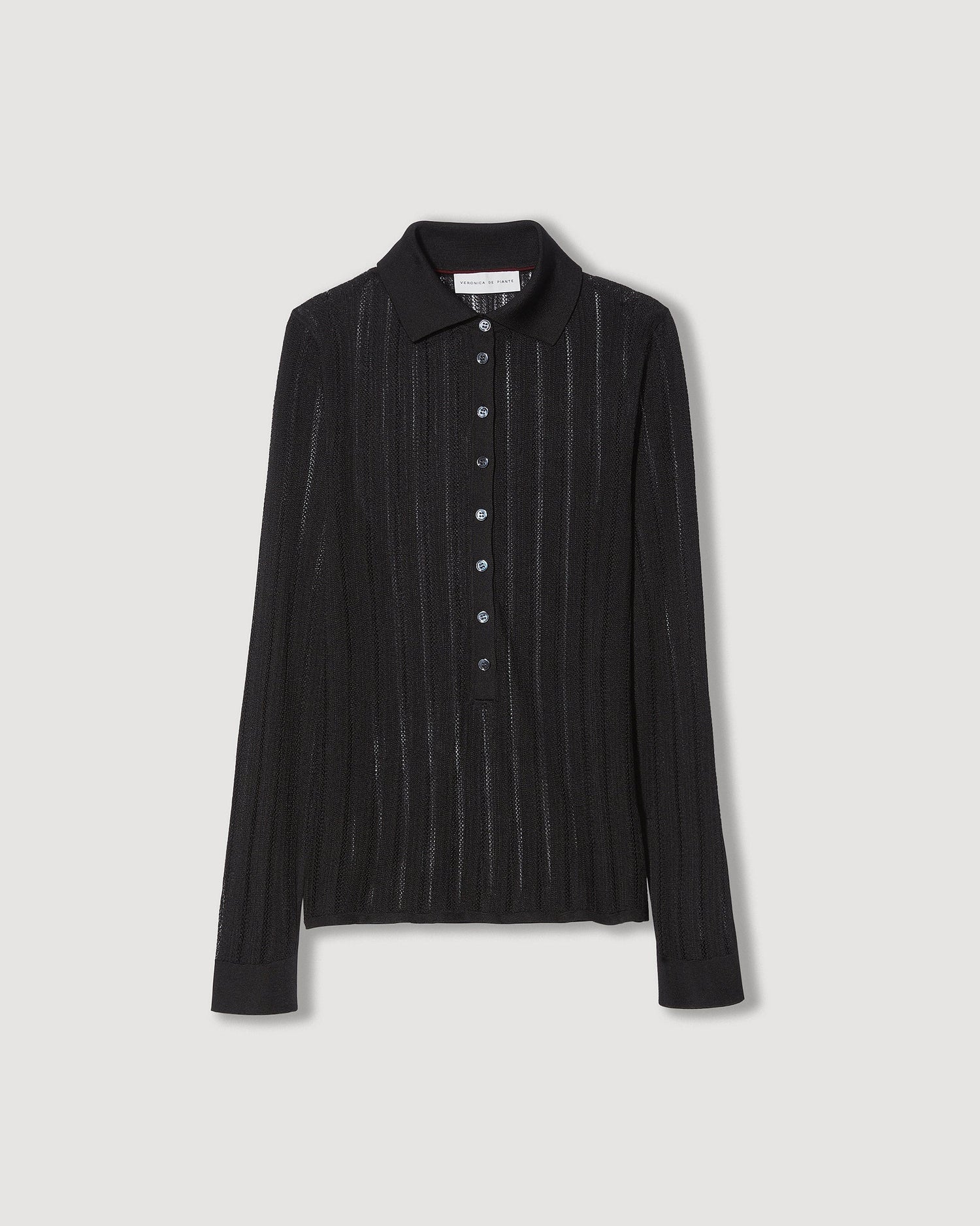Black Lydia Silk Crepe Polo in knitwear by SALE, showcasing the elegant fabric and classic fit on a model.