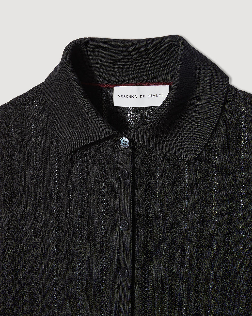 Black Lydia Silk Crepe Polo knitwear top, stylish and comfortable, with a classic fit and smooth silk crepe fabric.
