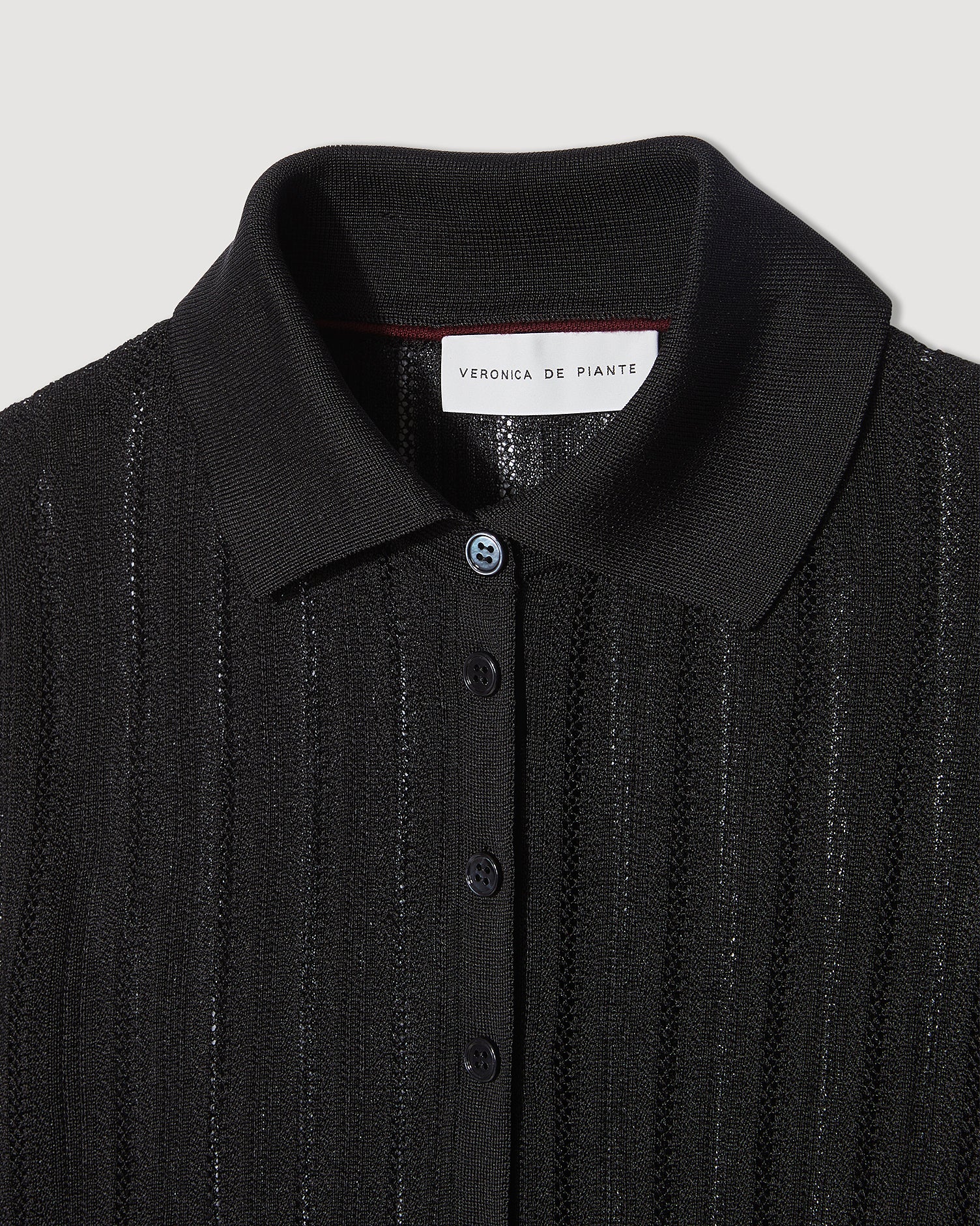 Black Lydia Silk Crepe Polo knitwear top, stylish and comfortable, with a classic fit and smooth silk crepe fabric.