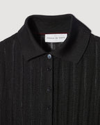 Black Lydia Polo in silk crepe knitwear by SALE, featuring a classic polo collar and smooth fabric texture.