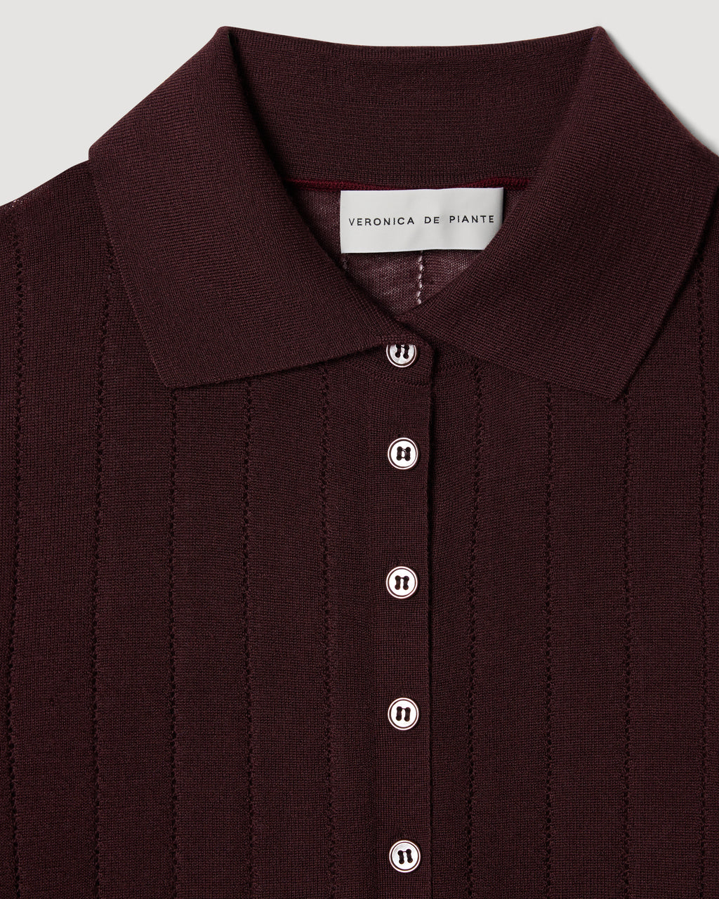 Veronica De Piante Luna Polo knitwear in burgundy cashmere, featuring a classic polo collar and soft, luxurious fabric.