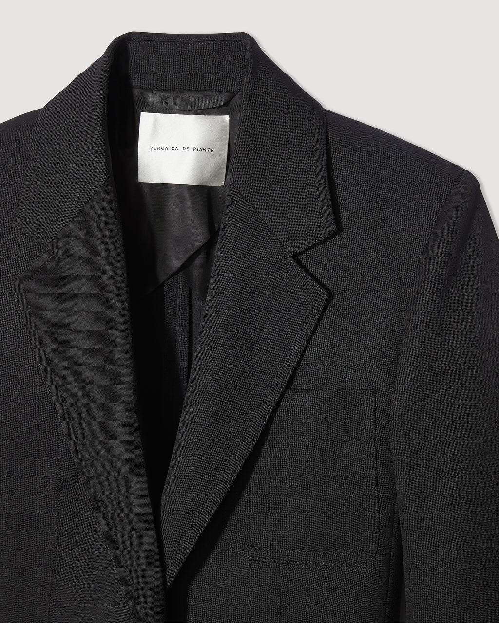 Black Wool Faye Jacket by Veronica de Piante, showcasing a tailored coat with a structured fit and classic style.