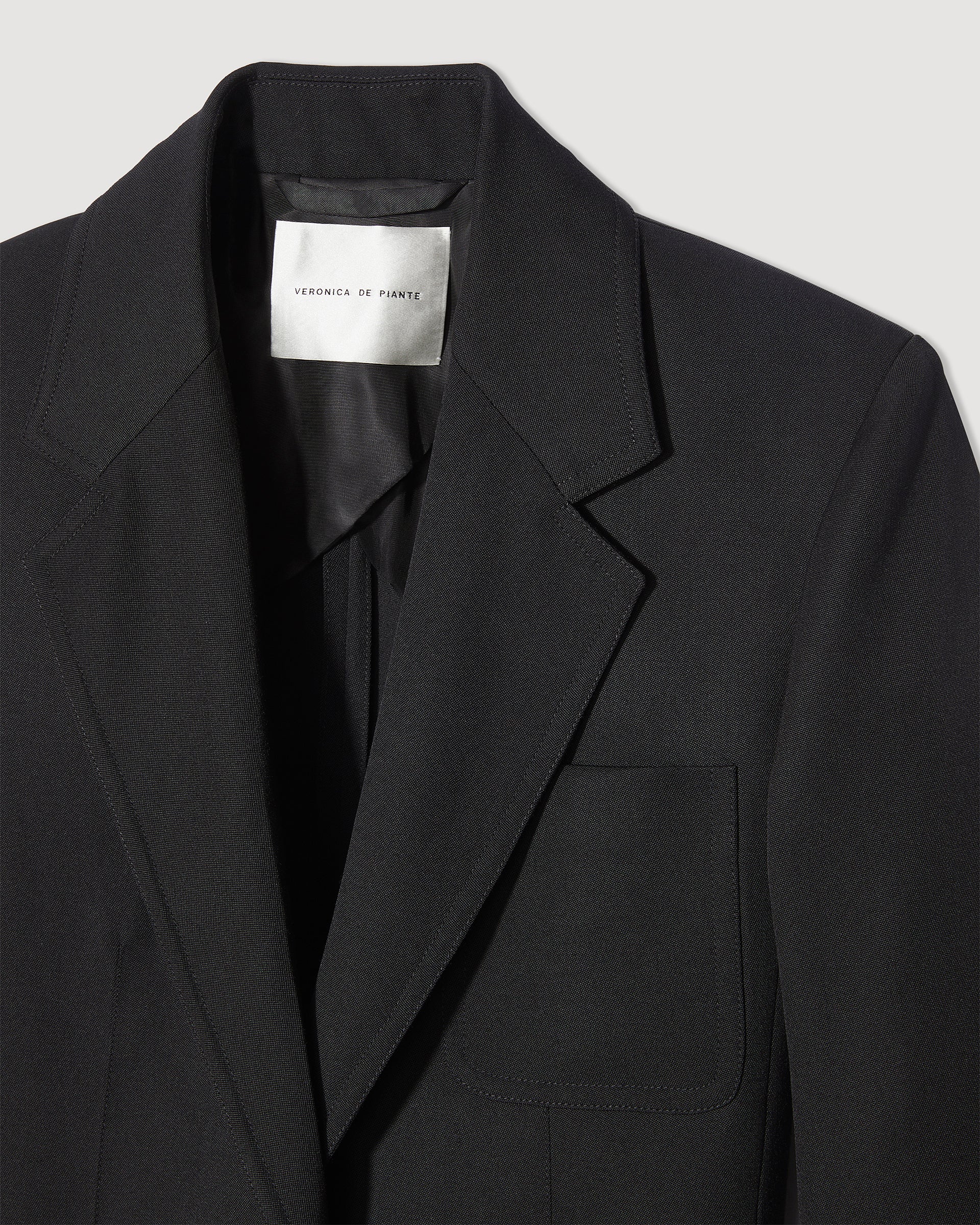 Black Wool Faye Jacket by Veronica de Piante, showcasing a tailored coat with a structured fit and classic style.