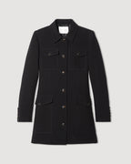 Black Alma Jacket in Viscose Crepe by Veronica De Piante, shown hanging with a tailored fit and stylish collar detail.