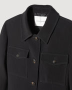 Veronica De Piante Alma Black Viscose Crepe Jacket, stylish coat with tailored fit and sleek black fabric, displayed on a hanger.
