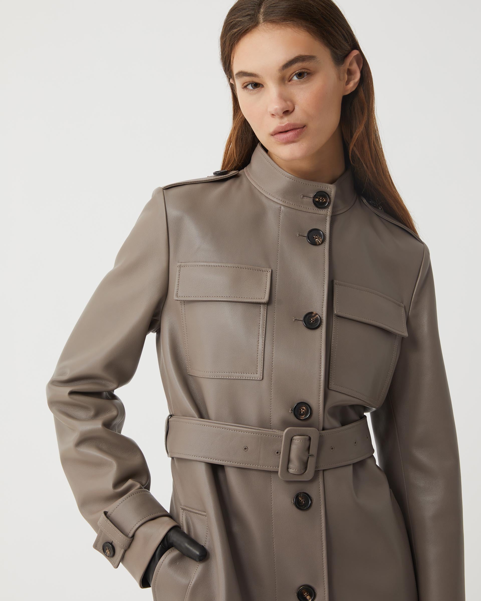 Celine Smog Nappa Leather coat displayed on a hanger, showcasing its sleek design and luxurious texture.