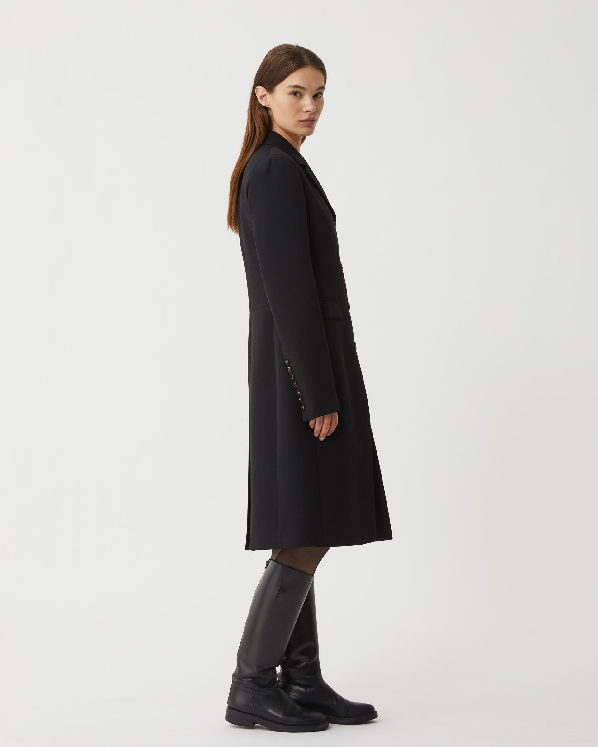 Black wool Manon coat by Veronica De Piante, showcasing a tailored silhouette and elegant design.