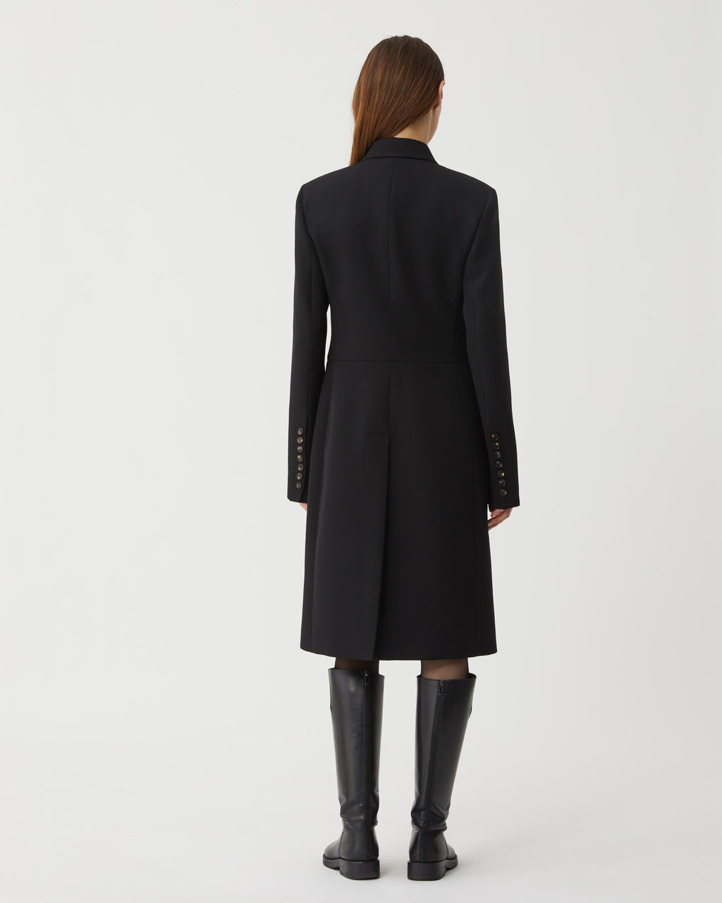 Black wool Manon coat by Veronica De Piante, featuring a tailored silhouette and elegant design, displayed on a mannequin.