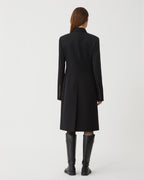 Black wool Manon coat by Veronica De Piante, featuring a tailored silhouette and elegant design, displayed on a mannequin.