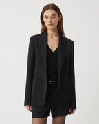 Black wool Faye jacket by Veronica de Piante, stylish coat with a tailored fit, shown on a model.