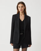 Black wool Faye jacket by Veronica de Piante, stylish coat with tailored fit and classic design, displayed on a hanger.