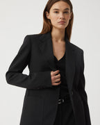 Black Faye Wool Jacket by Veronica de Piante, shown on a hanger, featuring a tailored coat with a sleek, minimalist design.