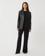 Black Blaire jacket in Nappa leather by Veronica De Piante, shown on a model, stylish and sleek coat perfect for modern fashion.