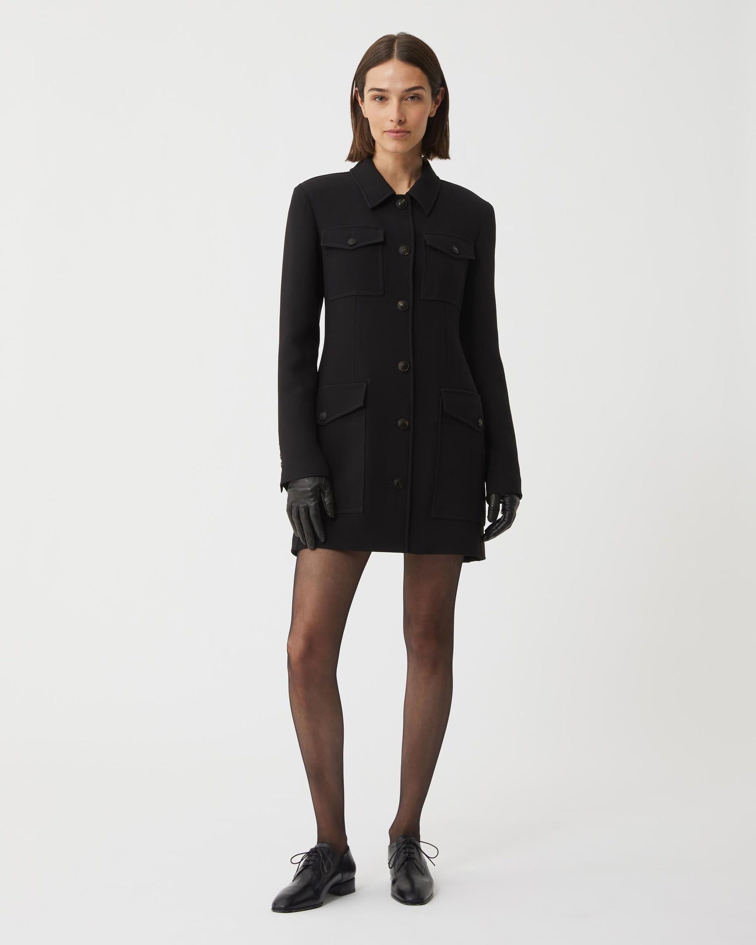 Black Veronica De Piante Alma jacket in viscose crepe, showing the tailored coat with a sleek collar and smooth fabric texture.