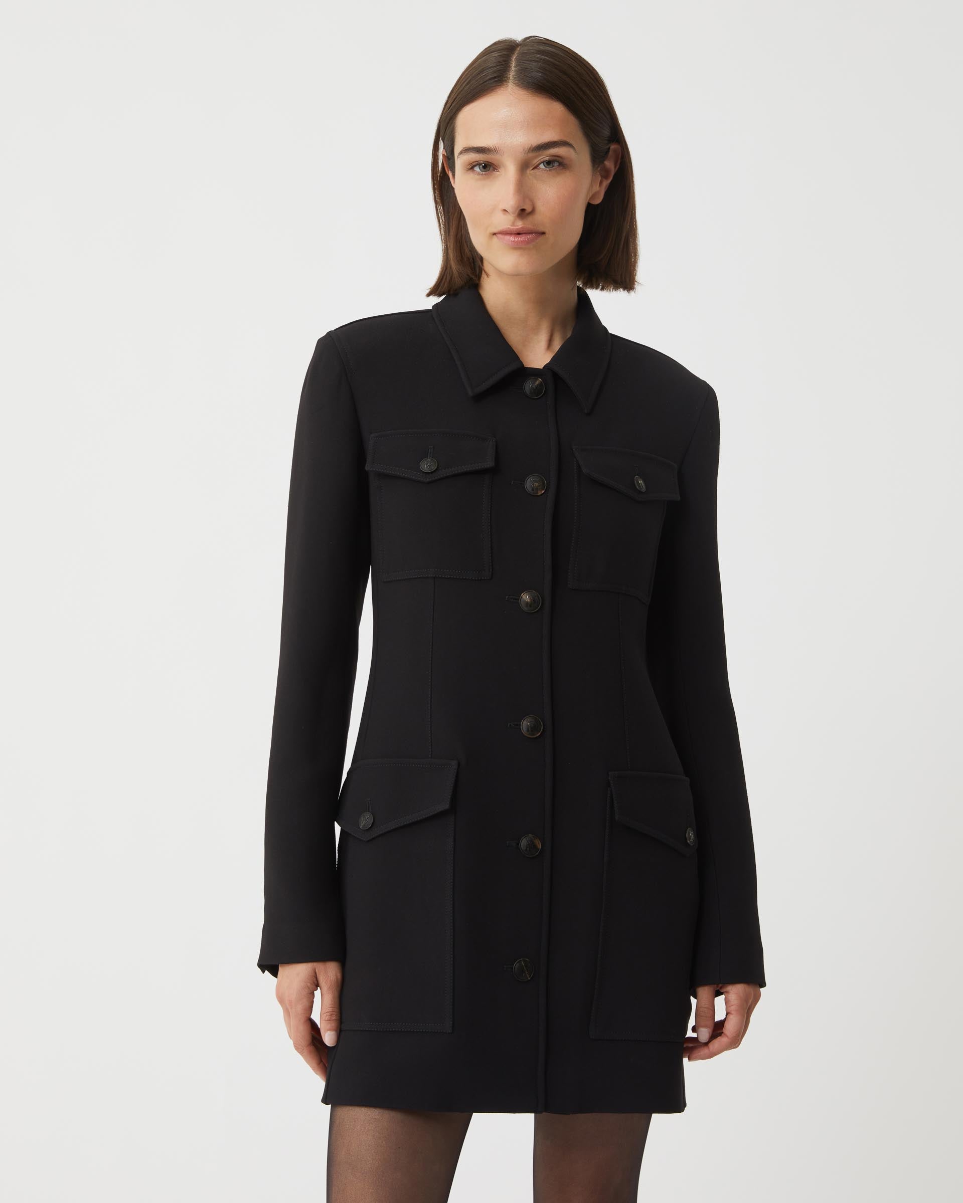 Black Alma jacket in viscose crepe by Veronica De Piante, displayed on a hanger with a tailored, sleek design.