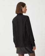 Black silk georgette Camille shirt by SALE, featuring a flowing design and elegant silhouette, displayed on a neutral background.