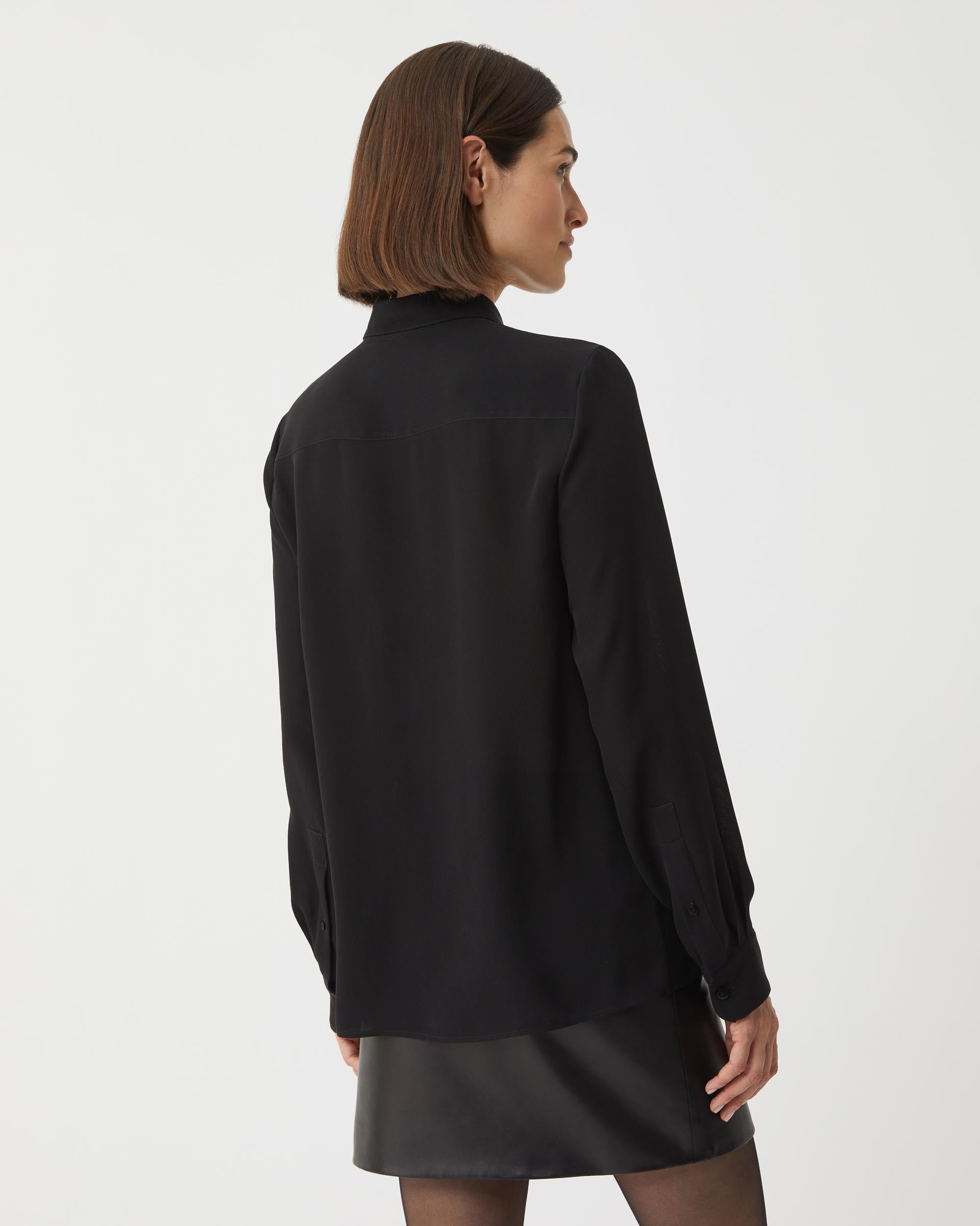 Black silk georgette Camille shirt by SALE, featuring a flowing design and elegant silhouette, displayed on a neutral background.