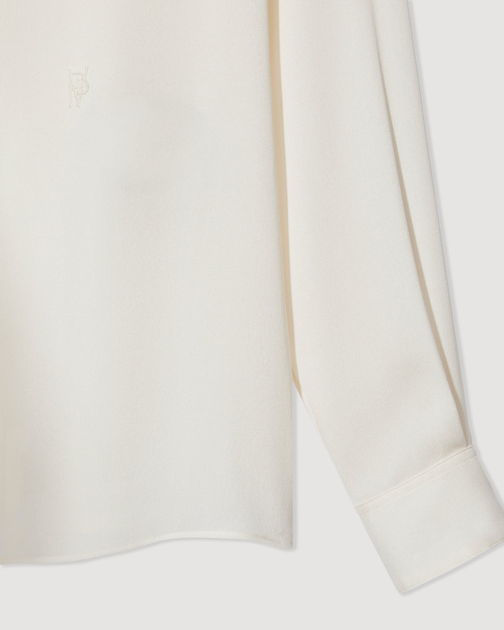 Ivory silk georgette Camille shirt, featuring a flowy design and delicate texture, perfect for stylish layering.