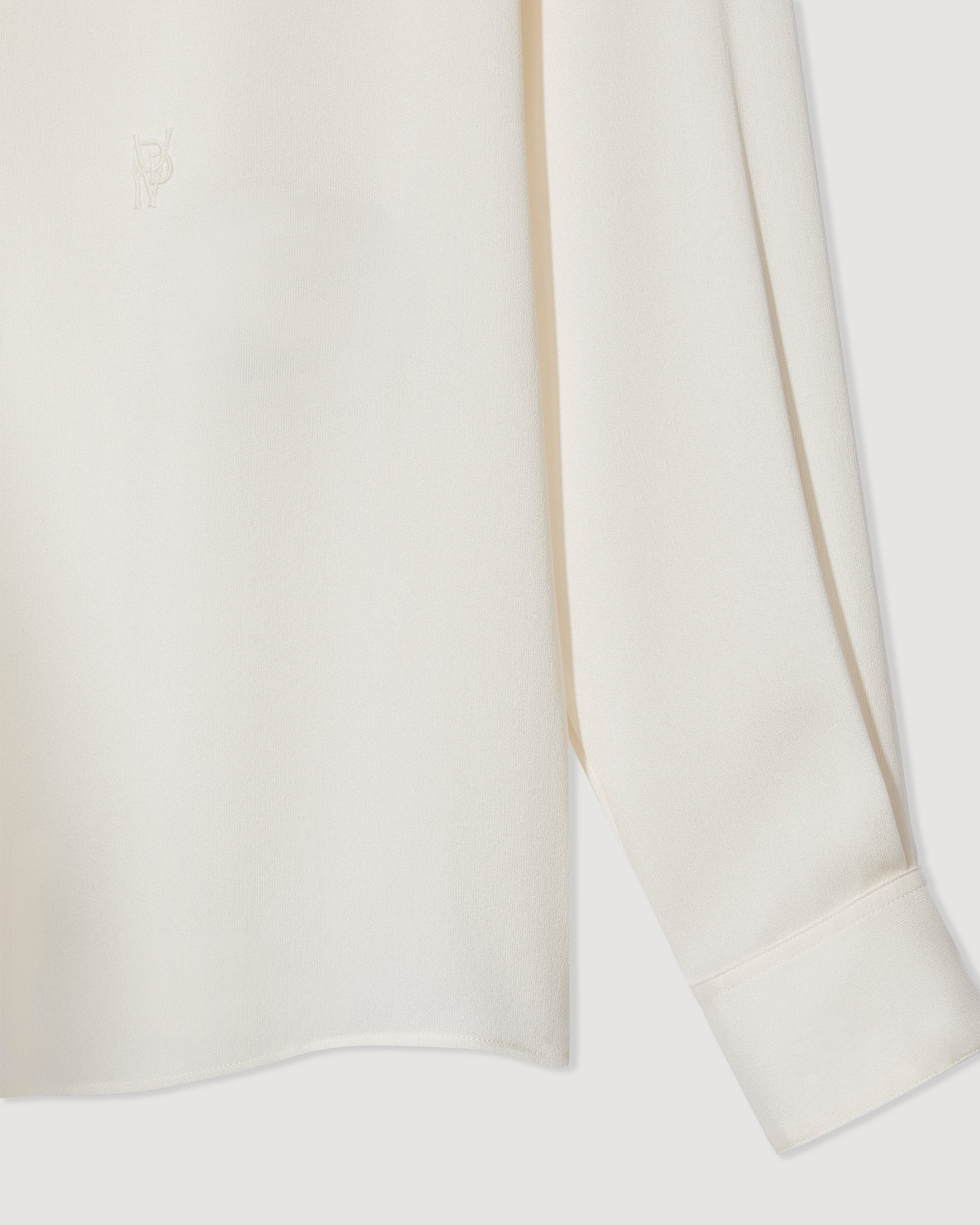 Ivory silk georgette Camille shirt, featuring a flowy design and delicate texture, perfect for stylish layering.