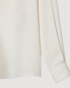 Ivory silk georgette Camille shirt by SALE, featuring a flowy design and elegant silhouette suitable for various occasions.