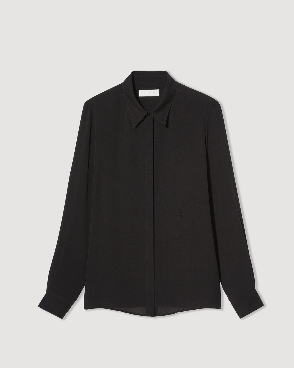 Black silk georgette Camille shirt by SALE, featuring a flowing design and elegant silhouette, displayed on a neutral background.