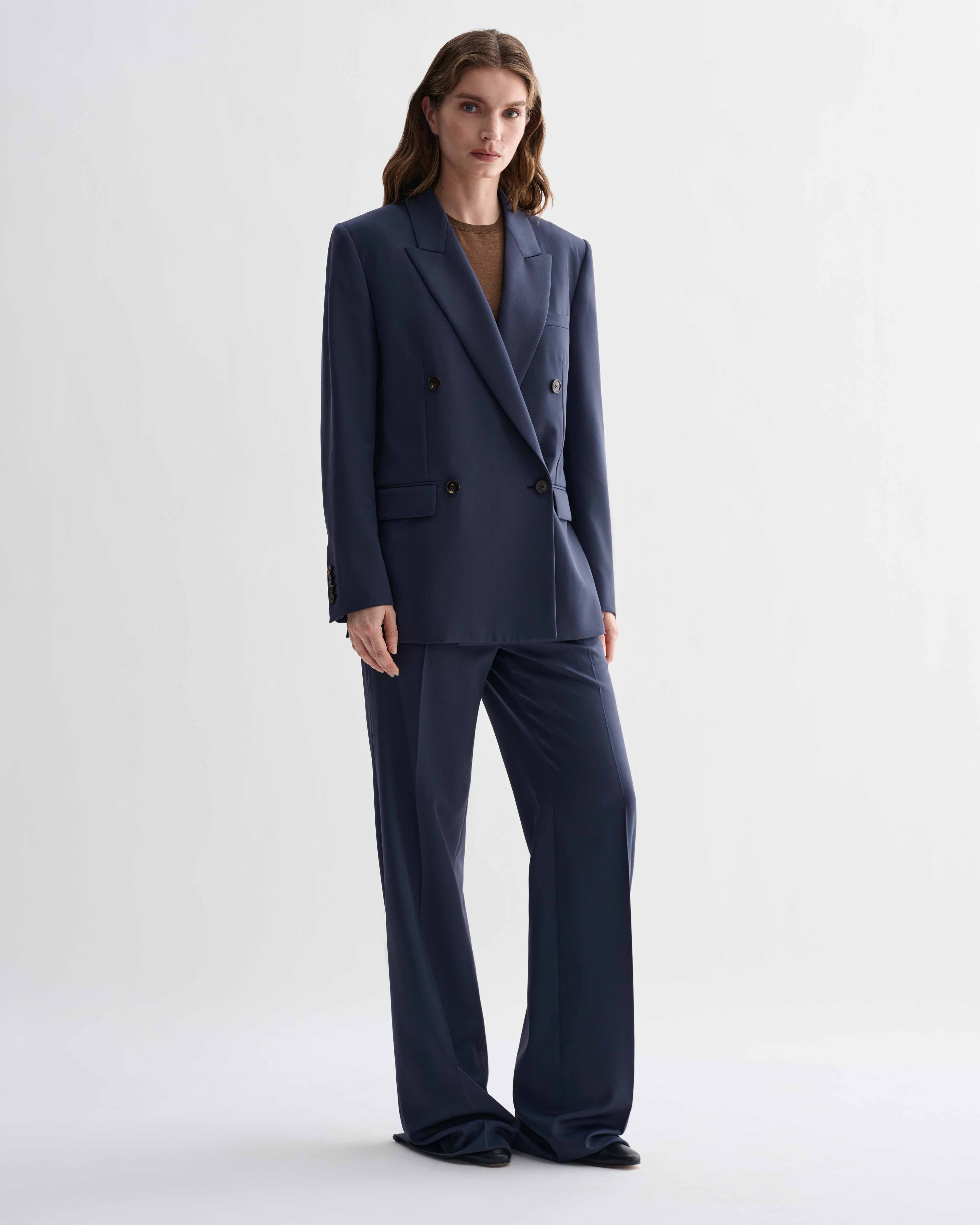Roman Double Breasted Jacket in Petrol Blue pure wool, menswear-informed tailored blazer and matching trousers on a female model