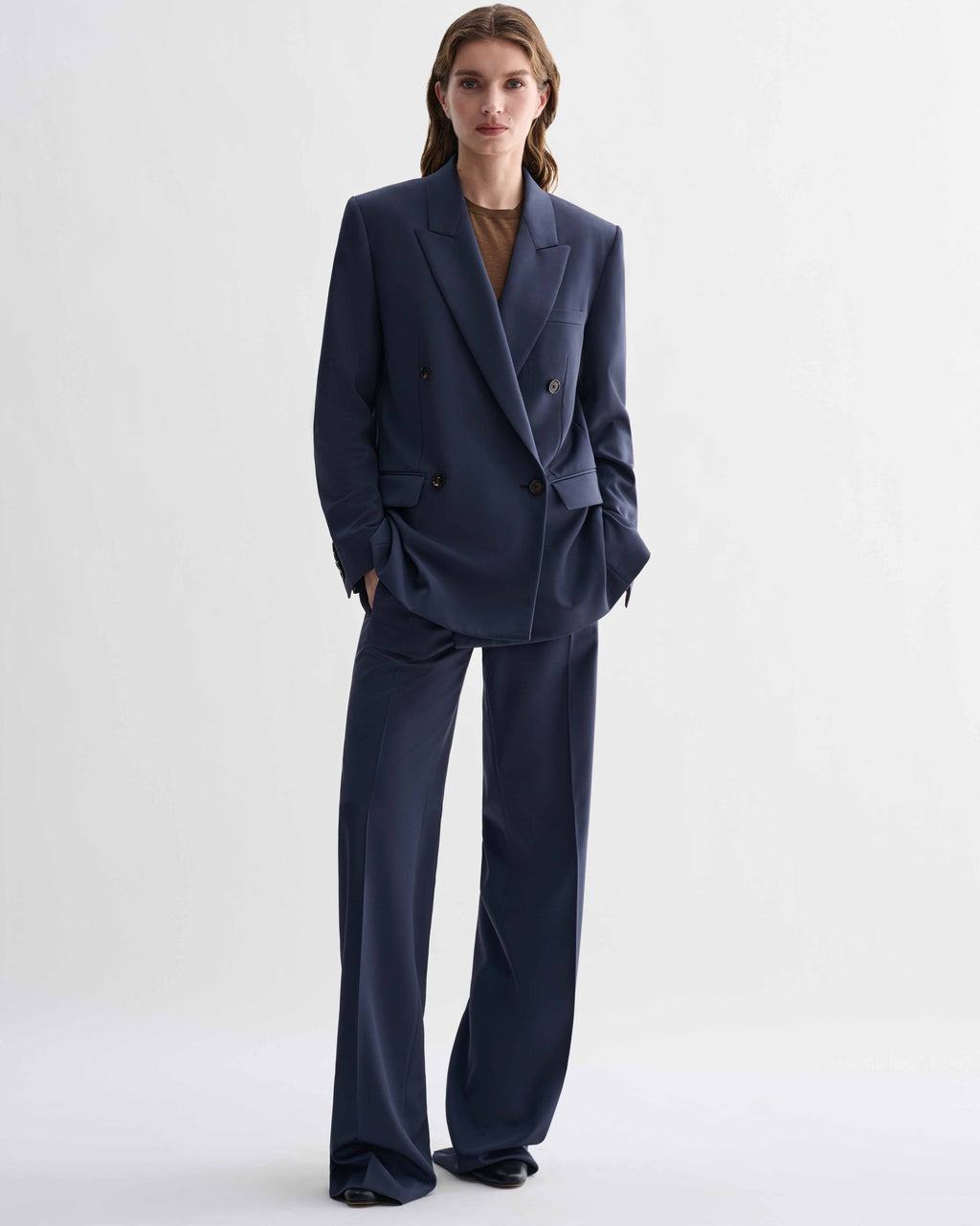 Roman Double Breasted Jacket in Petrol Blue wool and matching wide-leg Dylan trousers. A precise, menswear-tailored suit
