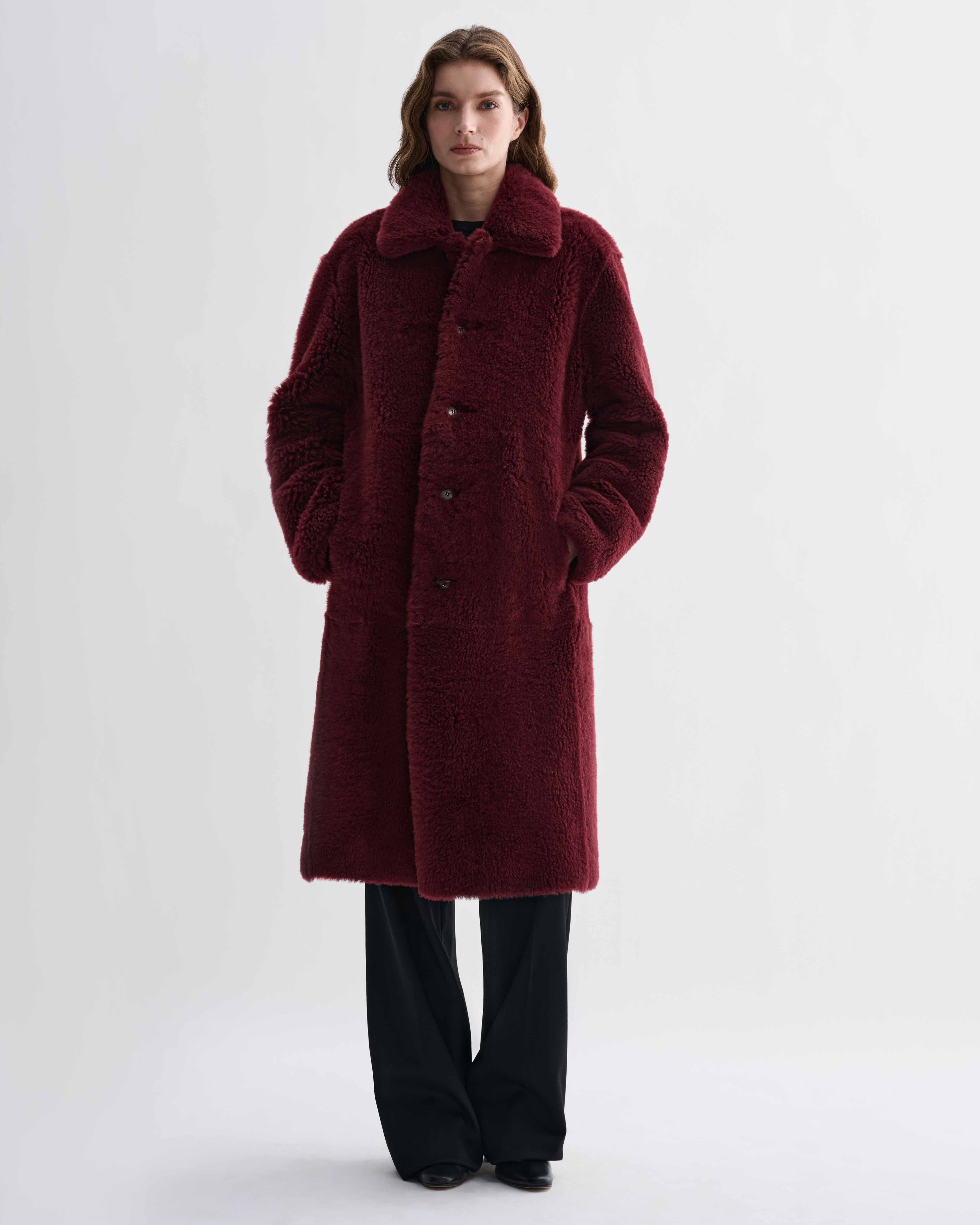 Romy double-faced shearling coat, bordeaux red. Voluminous women's luxury midi coat with front buttons, composed silhouette