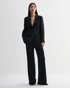 Black Sebastian structured stretch wool twill blazer on model, styled with Taylor trousers forming a luxury straight fit women's suit