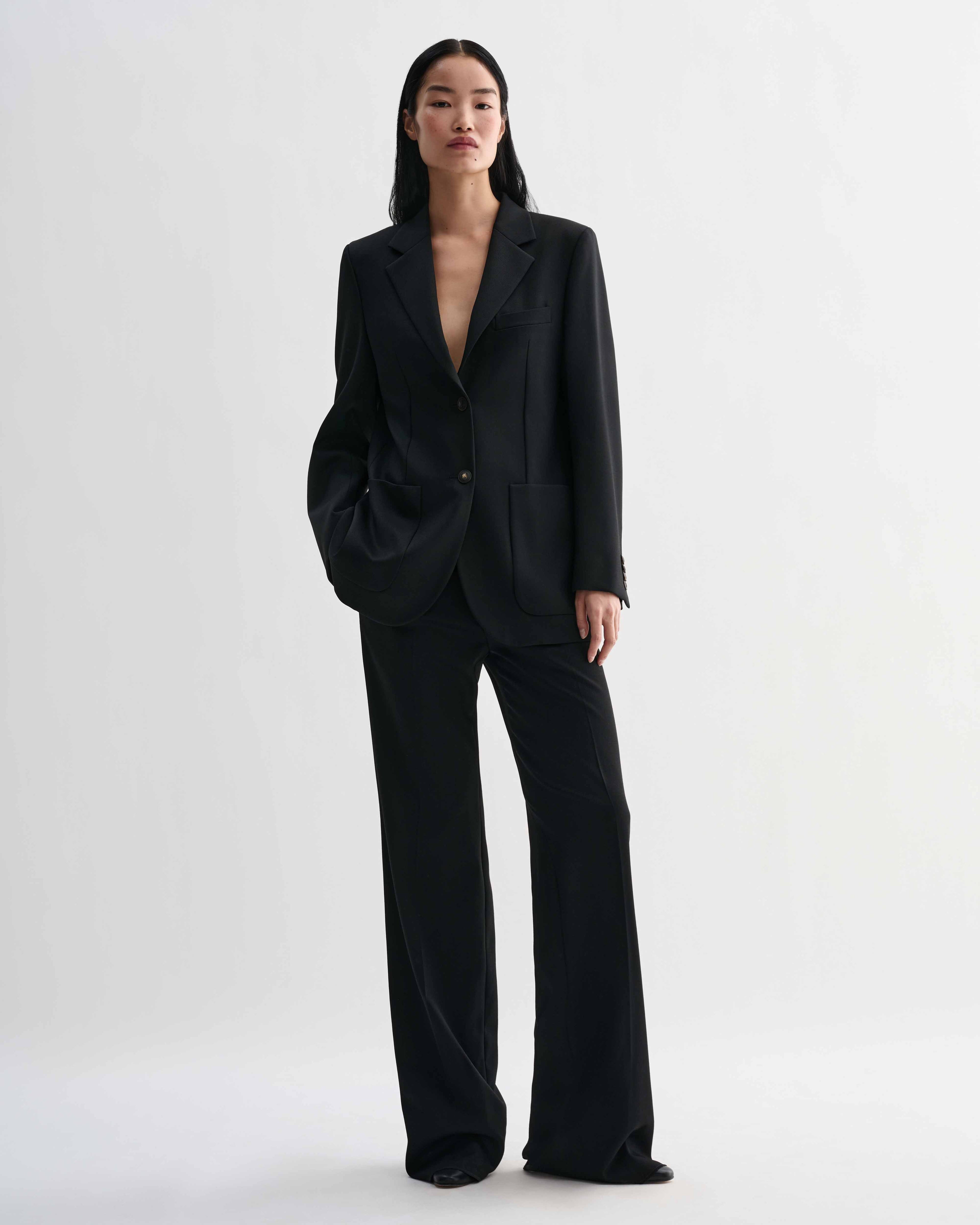 Black Sebastian structured stretch wool twill blazer on model, styled with Taylor trousers forming a luxury straight fit women's suit