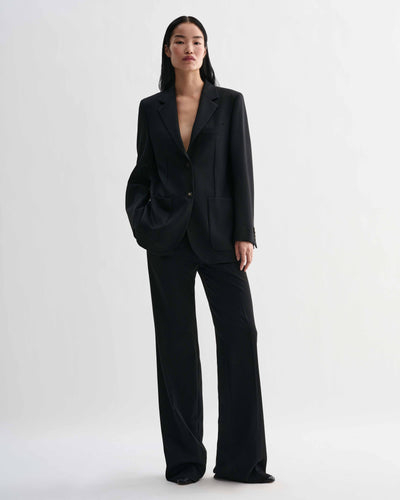 Black Sebastian structured stretch wool twill blazer on model, styled with Taylor trousers forming a luxury straight fit women's suit