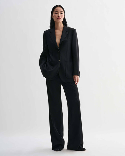 Black Sebastian structured stretch wool twill blazer on model, styled with Taylor trousers forming a luxury straight fit women's suit
