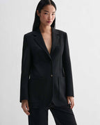 Black Sebastian Jacket blazer in stretch wool twill. Structured, straight fit jacket with single button closure and patch pockets
