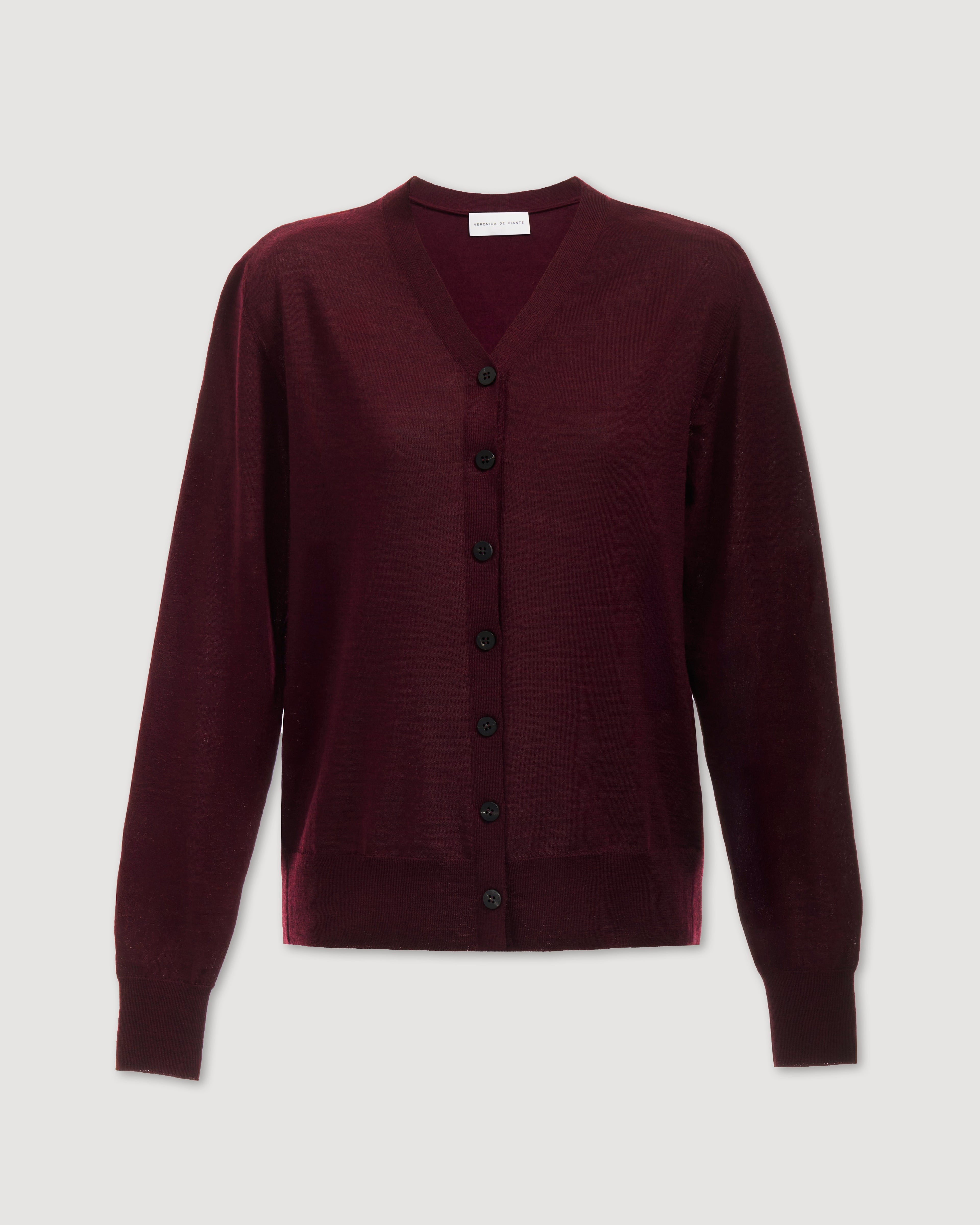 Katie Merino Wool Cardigan in Garnet, deep plum knitwear with a cozy fit and button details, showcased on a model.