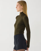 Olive green Evanne silk crepe turtleneck sweater by Veronica De Piante, showcasing its smooth knit fabric and stylish fit.