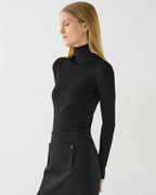 Black silk knit Evanne turtleneck sweater, featuring a soft texture and fitted design, perfect for stylish layering.
