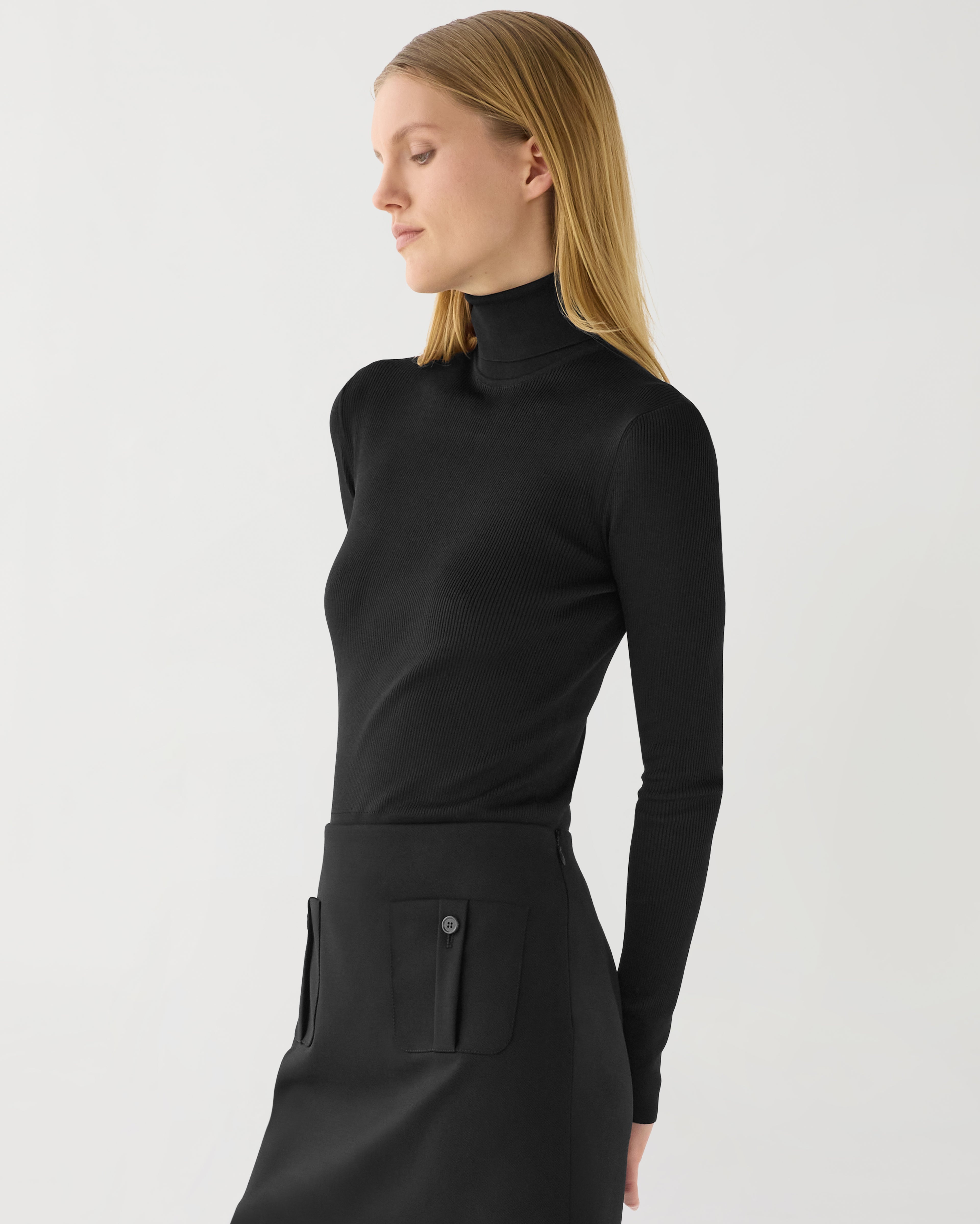 Black silk knit Evanne turtleneck sweater, featuring a soft texture and fitted design, perfect for stylish layering.