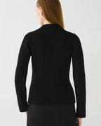 Black Ivy Merino wool ribbed knit sweater, semi-fitted long sleeve, worn by woman from back