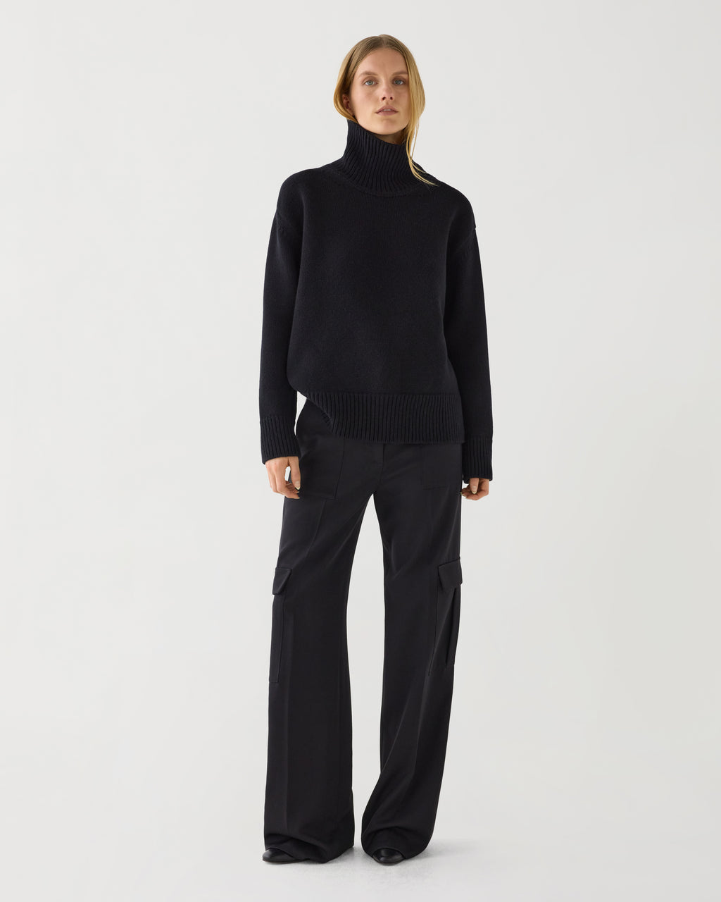 Black Delphine sweater by Veronica De Piante in soft wool cashmere knitwear, shown on a model.