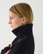 Black Delphine sweater in wool cashmere by Veronica De Piante, showcasing its cozy knitwear design and soft texture.