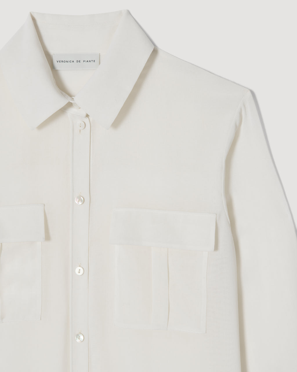 Off-white Jamie shirt in wool voile, featuring a relaxed fit and soft texture, styled on a neutral background.