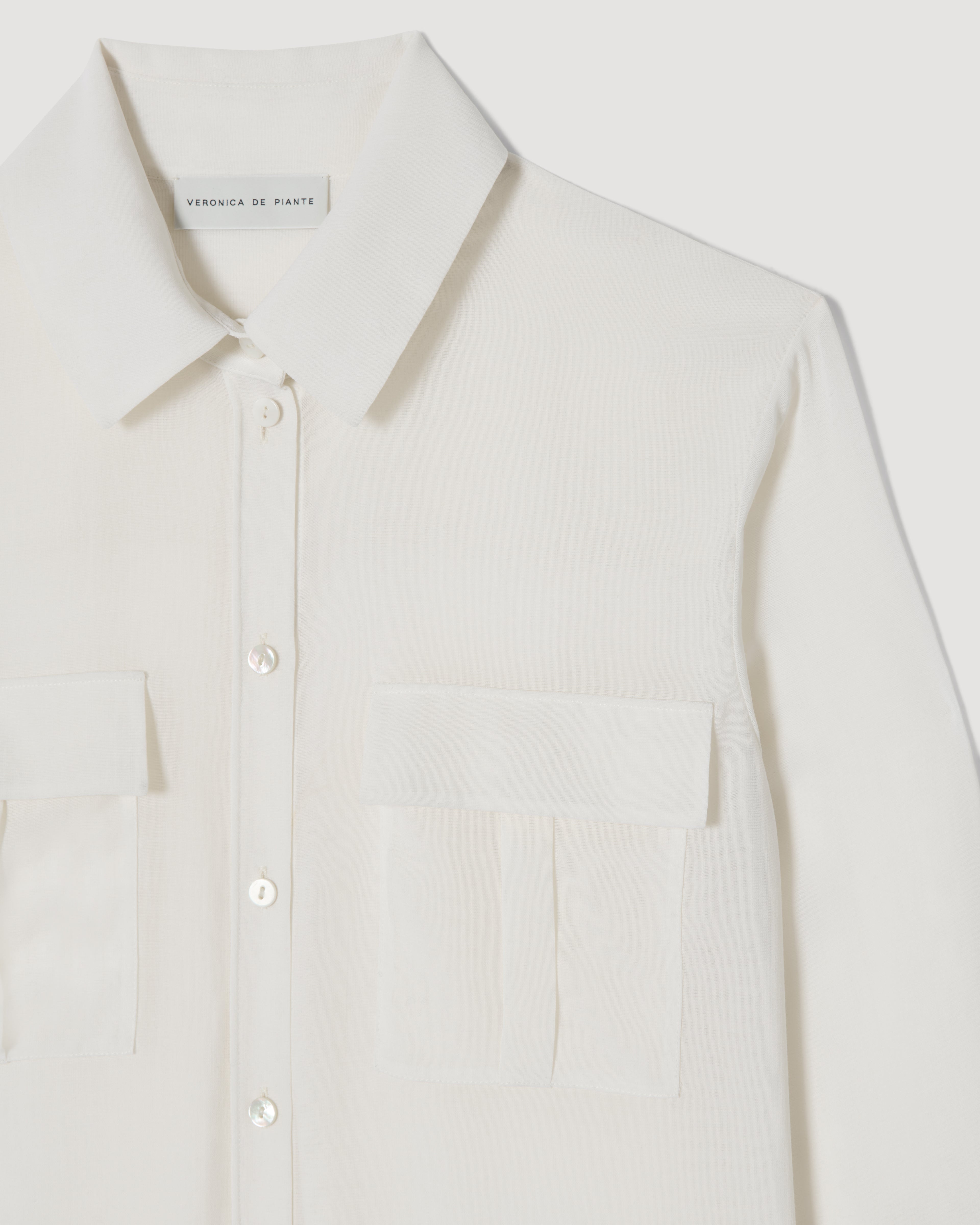 Off-white Jamie shirt in wool voile, featuring a relaxed fit and soft texture, styled on a neutral background.