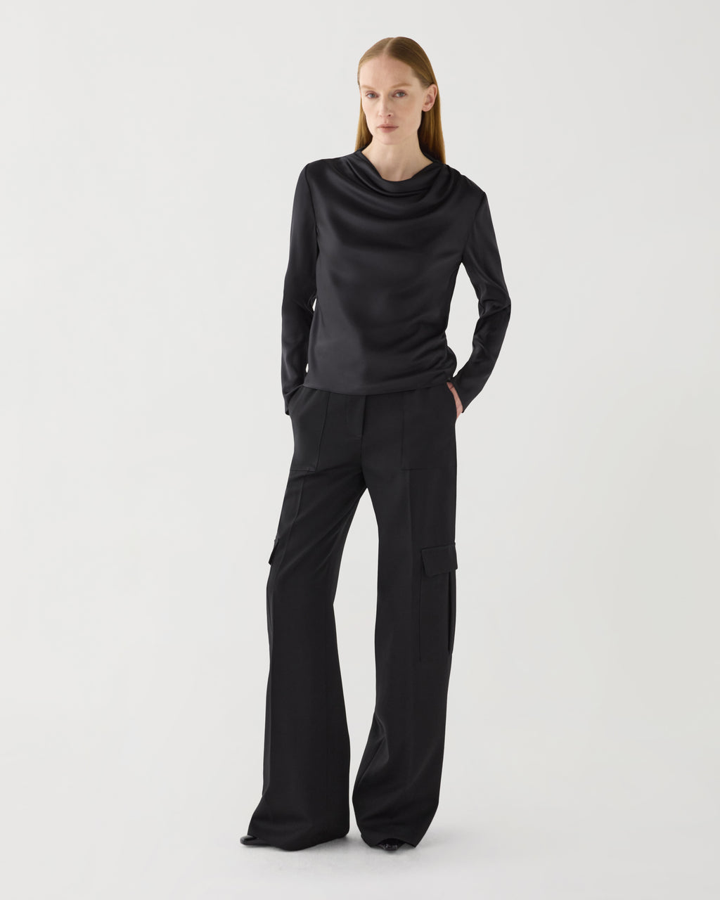 Black stretch silk Cecilia top by SALE, featuring a sleek design and elegant drape, shown on a neutral background.