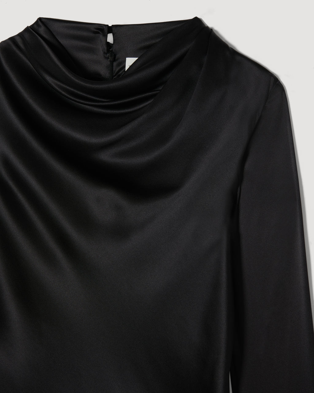 Black Cecilia top in stretch silk by SALE, featuring a sleek design and soft fabric, displayed on a neutral background.