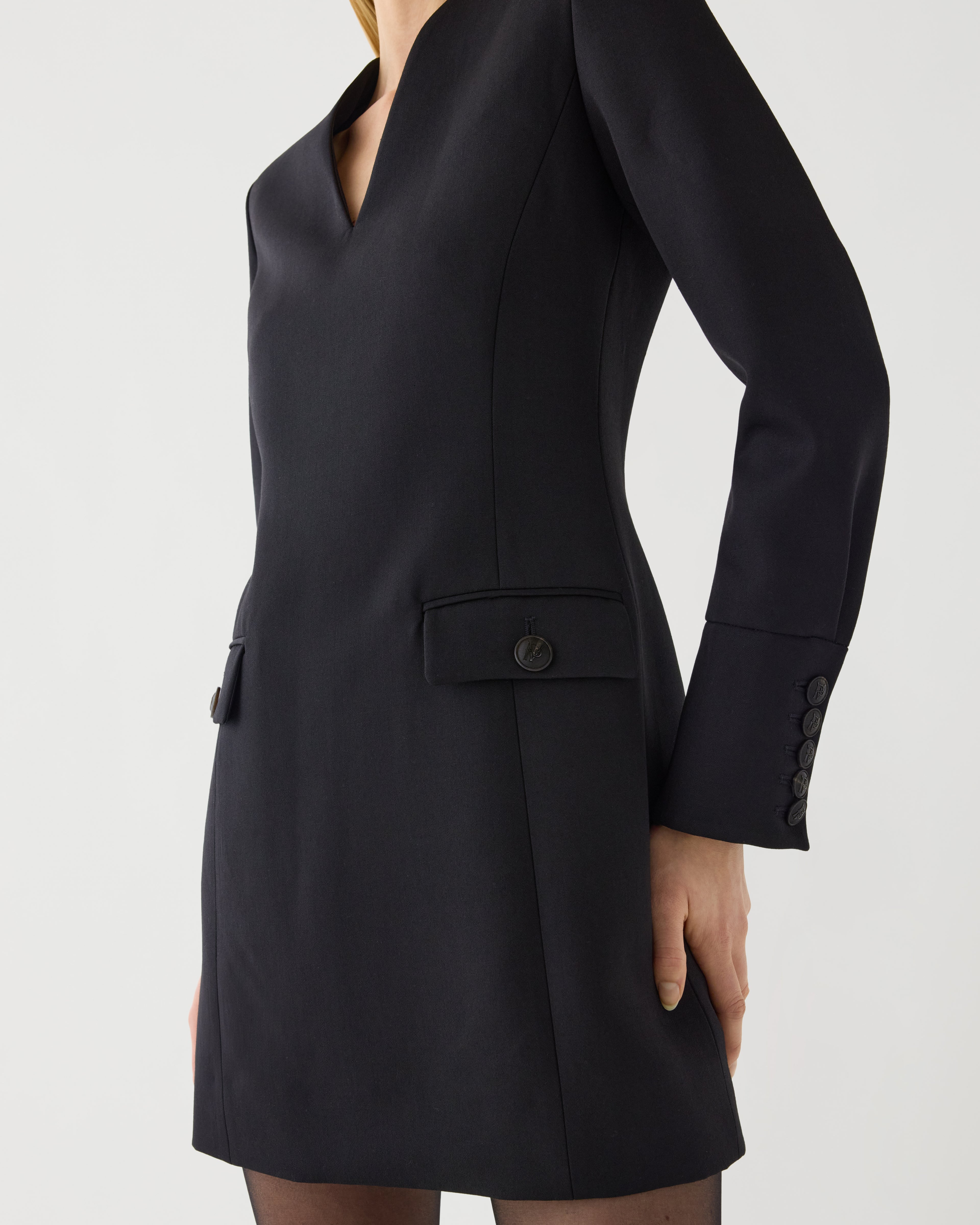 Black Elsie Dress in Grain de Poudre Wool by SALE, showcasing a stylish, fitted dress with long sleeves and elegant design.