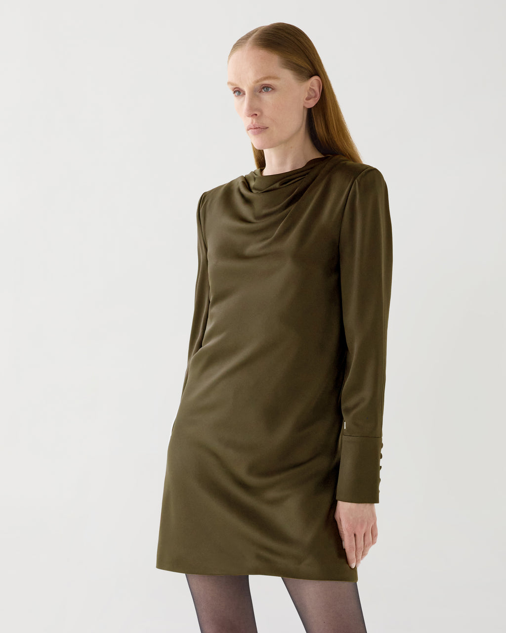 Olive green Amal dress in stretch silk by Veronica De Piante, shown on a model with flowing fabric and elegant design.