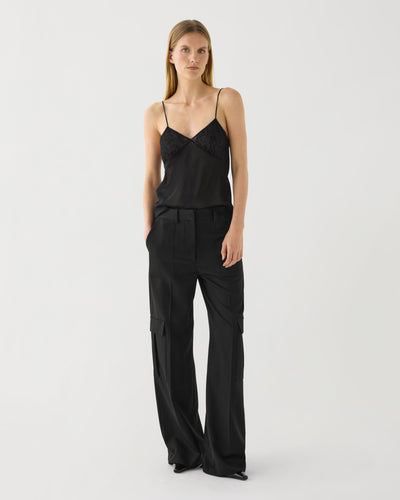 Black Etta Trouser in Grain de Poudre Wool by Veronica De Piante, showing tailored waistband and slim-fit leg design.
