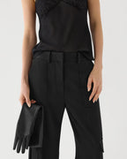 Black Etta trousers in grain de poudre wool by Veronica De Piante, featuring tailored design and classic fit.